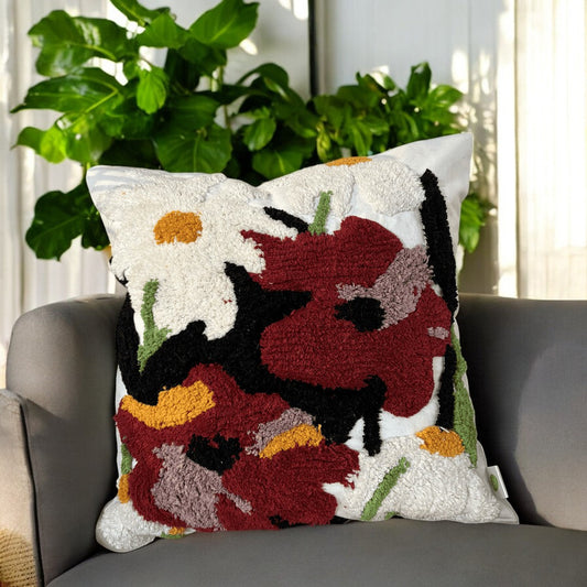 Tufted floral cushion on modern chair with indoor plants in the background, showcasing Lushlyf’s biophilic design aesthetic.