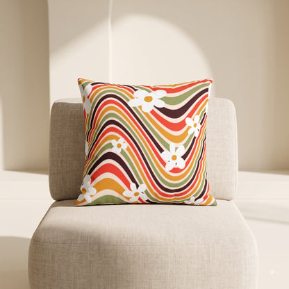 Blooming Wave Drift floral cushion cover by Lushlyf on a beige lounge chair