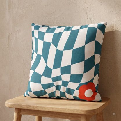 Ripple Chequered Spill cushion cover with teal checkerboard pattern and coral flower