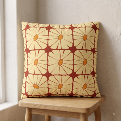 Sunbeam Grid Bloom yellow and terracotta floral cushion cover on a wooden stool