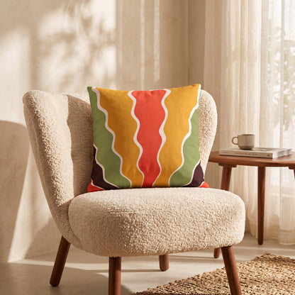 Sunset Ripple Flow abstract cushion cover styled on a woven wooden chair